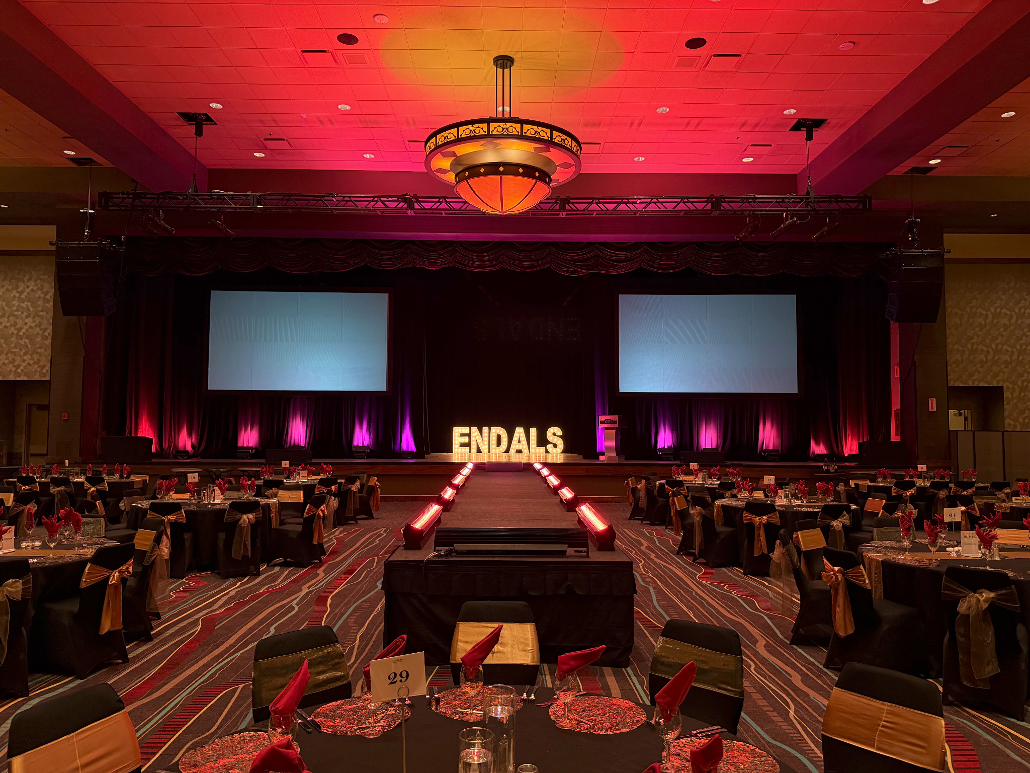 Gala ballroom with runway, projection, audio, and event lighting
