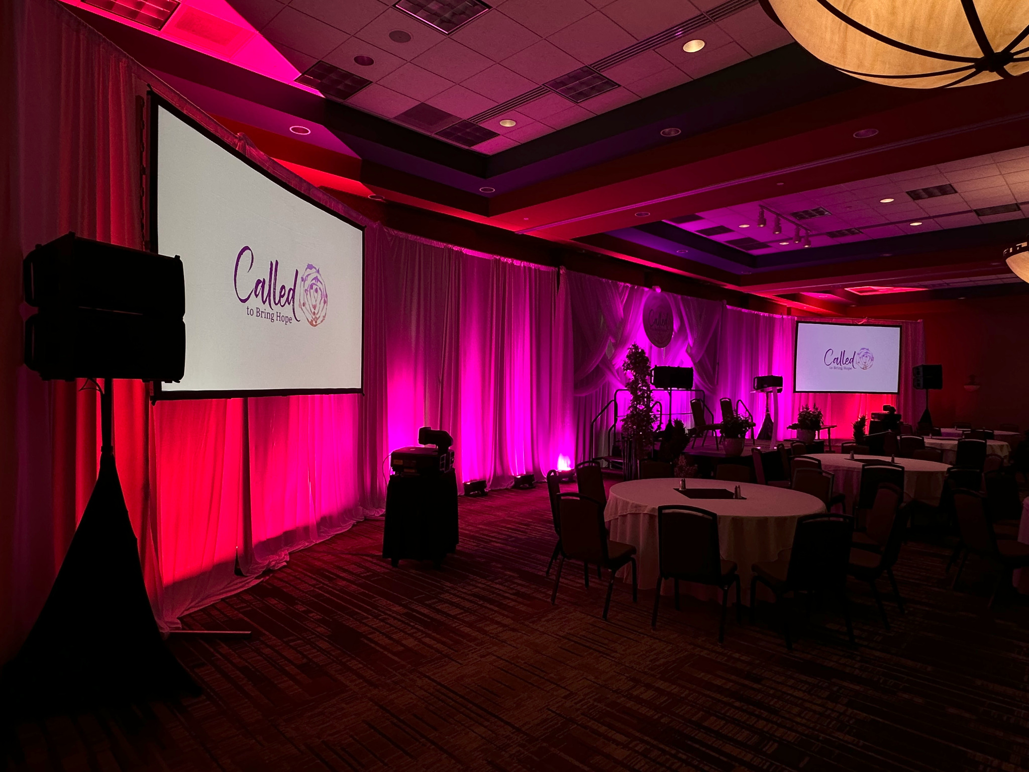 Ballroom transformed with projection and pink event lighting